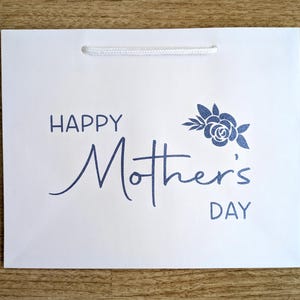 Happy Mother's Day gift bag with blue glitter text.