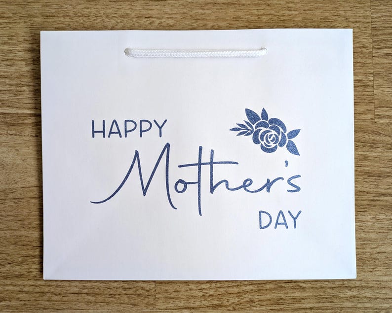Happy Mother's Day gift bag with blue glitter text.