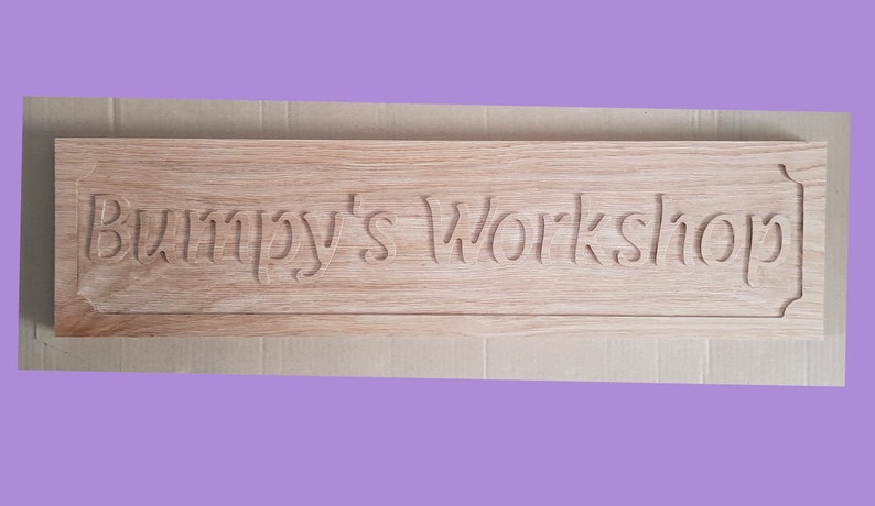 May include: A wooden sign with the text "Bumpy's Workshop" carved into it.