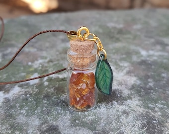 Amber vial with a leaf