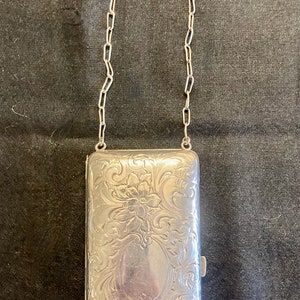 Leaving on March 27.  Silver plated purse. Flapper. Kindly view photos to be delightfully surprised. Good quality. 5.25 inches X 2.5 inches.