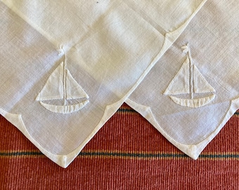 7 antique/vintage handkerchiefs including 3 wedding, 2 white on white appliqué, a fine lawn and a handkerchief envelope with fine embroidery