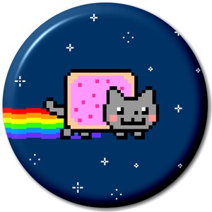 May include: A pixelated cat wearing a pink and white toast costume with a rainbow trail behind it. The cat is on a dark blue background with white stars.