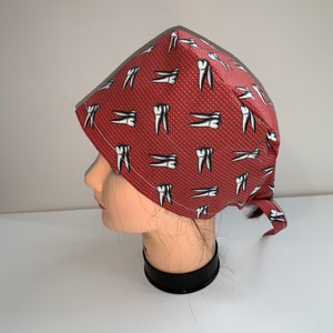 Molars on red background scrub cap