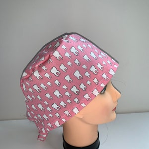Molars on pink background scrub cap