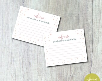 May include: Two white cards with pink confetti and the text "advice and well wishes for the soon-to-be Mrs." printed on them.