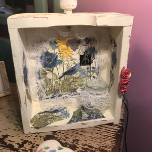 Beautifully decorated wood box table light