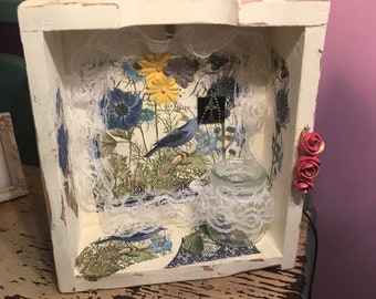 Beautifully decorated wood box table light