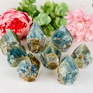 Blue onyx crystal points , top polished cut base tower