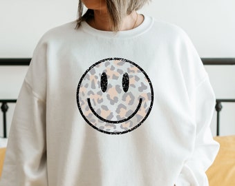 sweater with smiley face