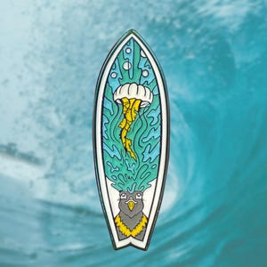 May include: A blue and green surfboard enamel pin with a yellow and white jellyfish and a black and yellow bird with a yellow beak.