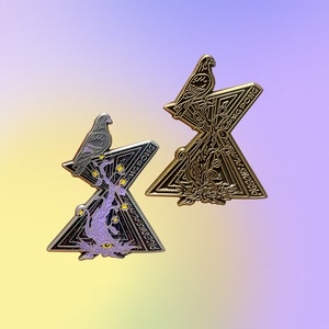 May include: Two gold-tone metal pins with a geometric design. The pins feature a stylized bird perched on a branch with leaves. The text "PIGEONS PLAYING" and "PING-PONG" are on the pins.