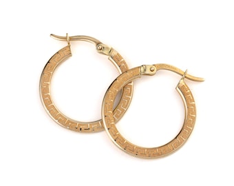 May include: A pair of gold hoop earrings with a geometric pattern. The earrings are made of 14k gold and have a diameter of approximately 2.5 cm.