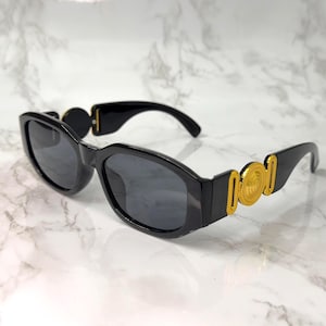 May include: A set of three ceramic mugs with a speckled, matte finish. The mugs are in shades of cream, light gray, and dark gray. Each mug has a simple, minimalist design, perfect for coffee or tea.