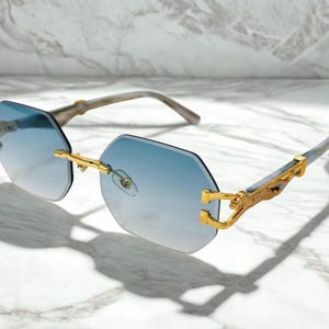 Gafas de sol vintage octogonales con lentes azules: montura dorada de lujo sin montura, gafas de moda retro, gafas unisex de estilo retro.
