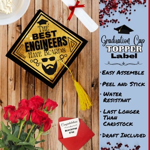 May include: Graduation cap topper with a gold background and black text that reads "The Best Engineers Have Beards". The topper features a cartoon image of a man with a beard and sunglasses. The topper is on a wooden surface with red roses and a red envelope with a white card that reads "Congratulations, We Are So Proud Of You".