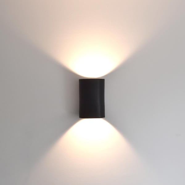 Handmade Black Ceramic Wall Sconce: Adjustable Light