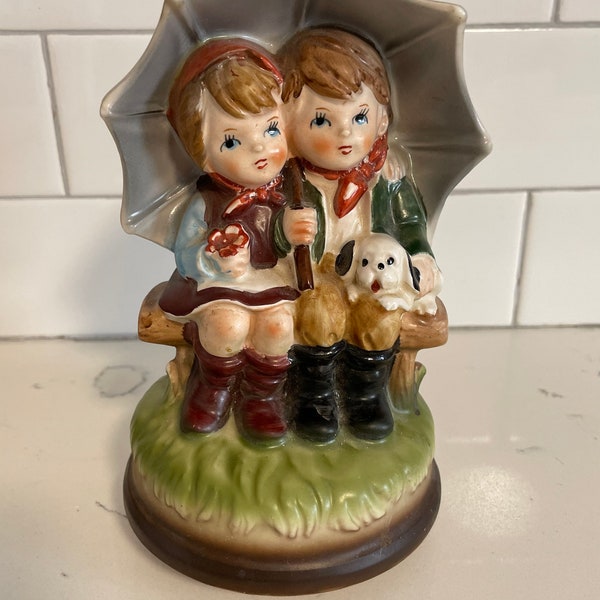 Vintage Japan “Hummel Style”Ceramic  Music Box Boy And Girl Under Umbrella