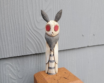 Hand Carved White Satin Mothman