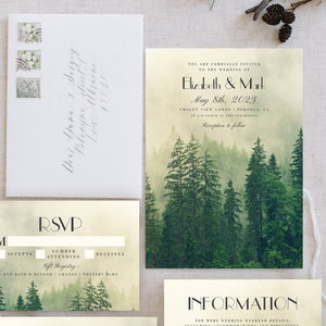 May include: A wedding invitation suite with a forest theme. The invitation features a watercolor illustration of a misty forest with tall pine trees. The text reads "You are cordially invited to the wedding of Elizabeth & Mark May 8th, 2023 Chalet View Lodge, Portola, CA at 5 o'clock in the afternoon. Reception to follow."