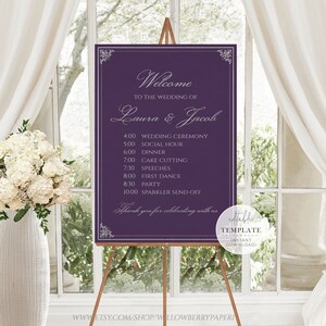 May include: Purple wedding welcome sign with a silver frame and white text. The sign lists the wedding ceremony, social hour, dinner, cake cutting, speeches, first dance, party, and sparkler send off times. The sign also includes the names Laura and Jacob.