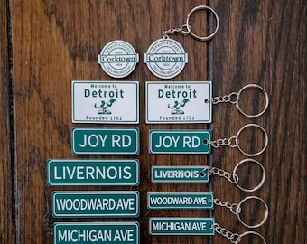 Detroit street sign magnets and keychains. Made in and ships from Detroit, MI USA. Woodward, Michigan Ave, Cass, Joy Rd, 7 Mile, 8 Mile