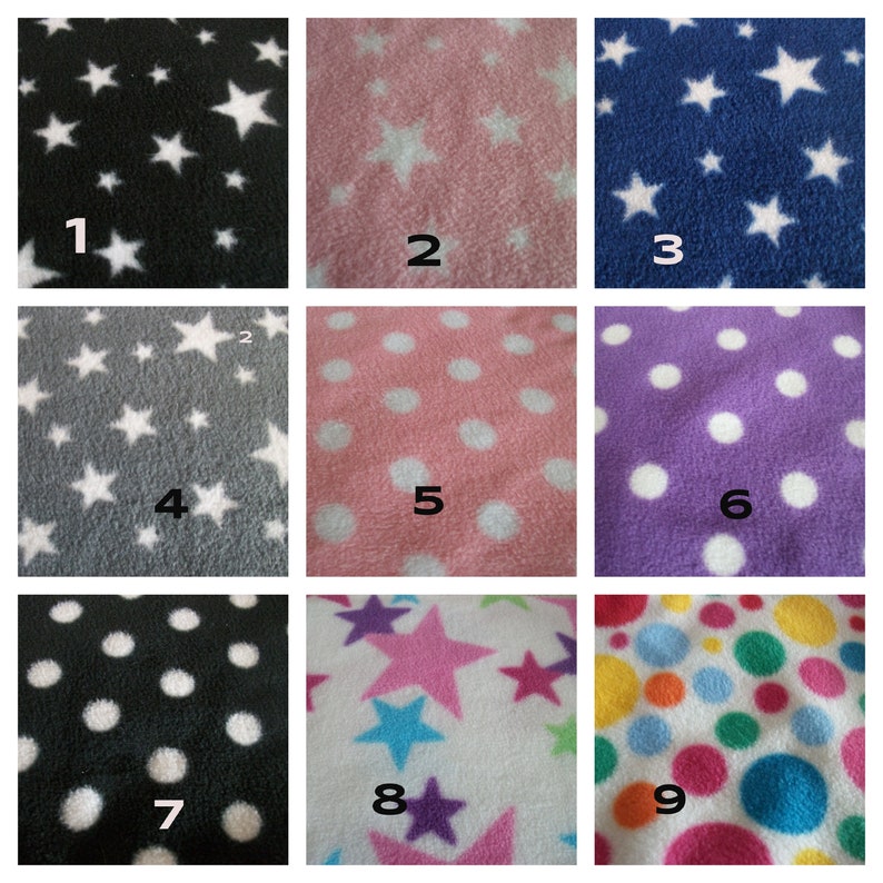 May include: Nine fabric swatches with different patterns. The swatches are arranged in a 3x3 grid. The patterns include white stars on black, pink, and blue fabric, white dots on gray, pink, and purple fabric, white dots on black fabric, pink and blue stars on white fabric, and multi-colored dots on white fabric.