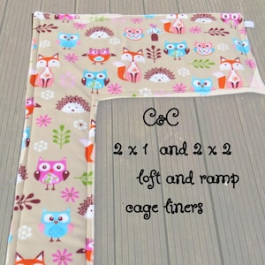 May include: Beige cage liner featuring a pattern of foxes, owls, and hedgehogs. The liner has a loft and ramp design, with text that reads "C&C 2 x 1 and 2 x 2 loft and ramp cage liners."