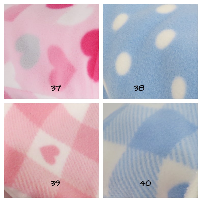 May include: Four fabric swatches with different patterns. The top left swatch is pink with white and pink hearts. The top right swatch is light blue with white polka dots. The bottom left swatch is white with pink and white checkered pattern and pink hearts. The bottom right swatch is white with light blue and white striped pattern.