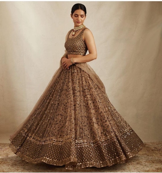 Karisma Kapoor's sequin midi dress is a wardrobe must have this festive  season