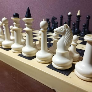 Chess set &quot;Schkolnyk&quot; on pegs for travel and for people with visual impairments