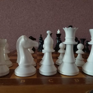 Vintage plastic chess set in wooden chessboard  from Ussr 1980s