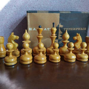 Chess pieces of the 1990s in their original box.
