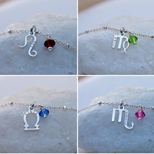 Puede incluir: Cuatro pulseras de plata con un dije de signo del zod&iacute;aco y una peque&ntilde;a cuenta de cristal. Los dijes son Leo, Virgo, Libra y Escorpio. Cada dije tiene el signo del zod&iacute;aco y el nombre del signo grabado en &eacute;l.
