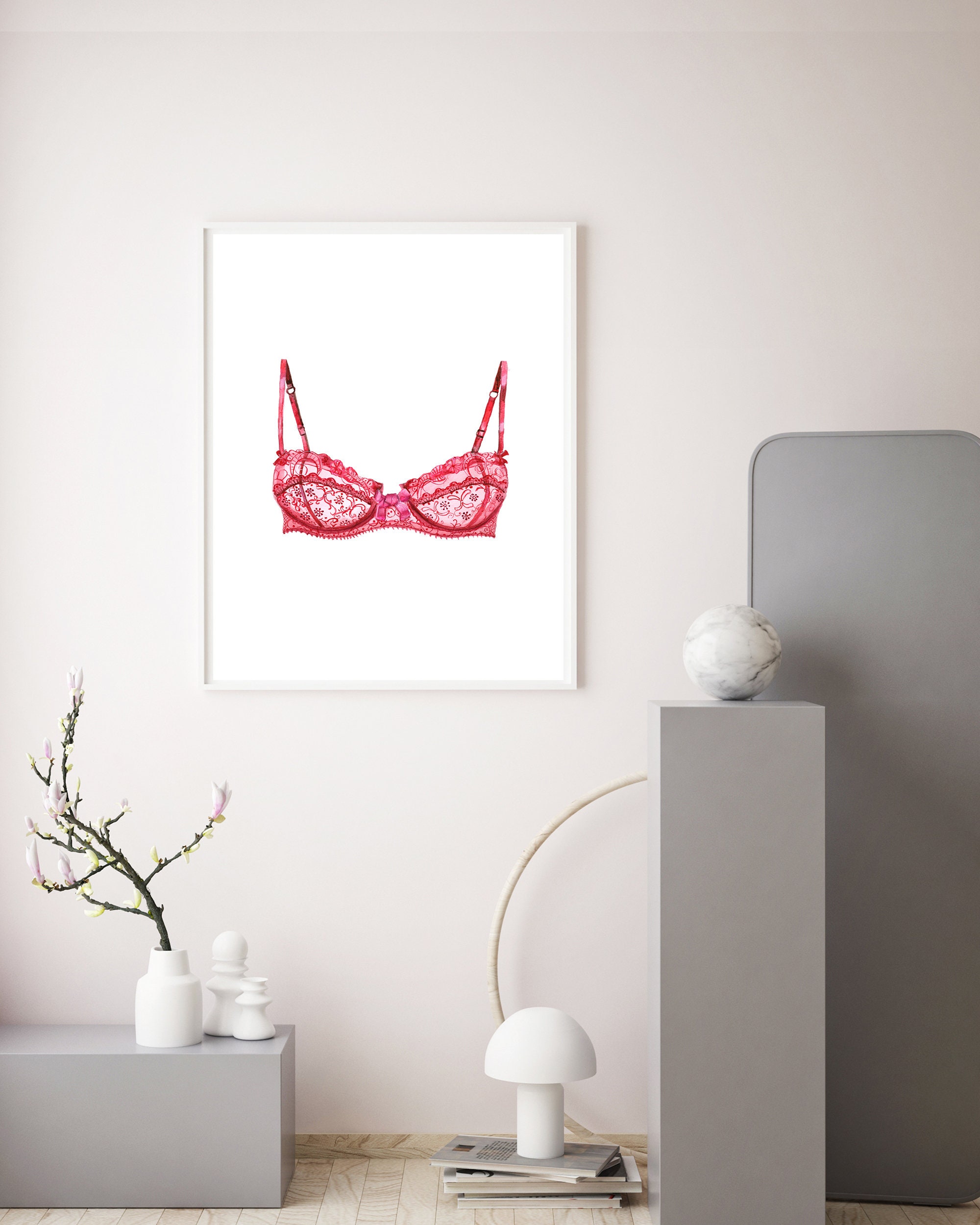 Watercolor black lace bras on hangers on white background