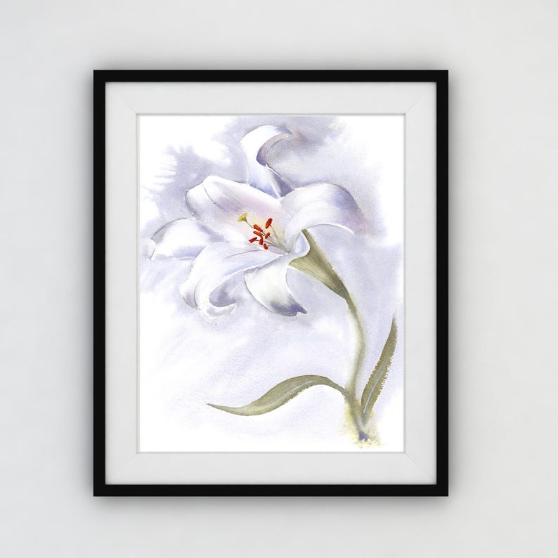 May include: Watercolor painting of a white lily flower with a yellow and red center, set against a soft, light purple background. The artwork is framed in a black frame, ready to hang. The botanical art print is a delicate and elegant piece.