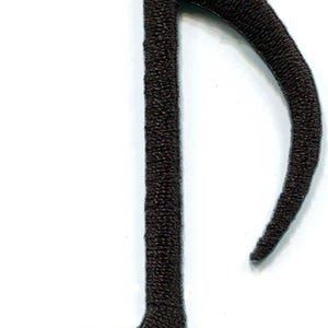 May include: A black embroidered musical note patch featuring a single eighth note design with a rounded bottom and a curved stem. The patch has a dense, textured thread finish and a clean, defined edge, suitable for application onto fabric surfaces.