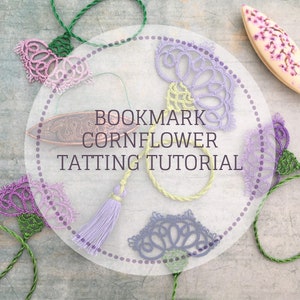 May include: A close-up of a craft project with a white circle containing the text "BOOKMARK CORNFLOWER TATTING TUTORIAL". The image shows several purple, blue, and green crocheted flowers with green stems.