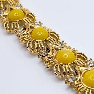 Gold tone openwork with clear rhinestone & yellow cabochon panel link bracelet 7 5/8 Inches long Rope style Floral Flower Flexible Statement