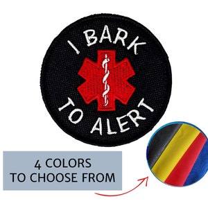 May include: Black embroidered patch with the text "I BARK TO ALERT" surrounding a red medical symbol. A small inset shows four color options. This patch is designed for pet owners.
