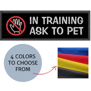 May include: A black embroidered patch with the text "IN TRAINING ASK TO PET" and a red hand symbol with a line through it. The image also shows a circle with the text "4 COLORS TO CHOOSE FROM" and a sample of four colored fabrics.