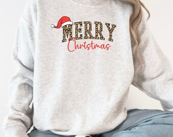 Leopard Print Merry Christmas Shirt, Personalized Holiday Tee, Festive Santa Hat Apparel, Trendy Xmas Gift Shirt, Cute Winter Wear