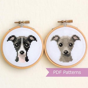 May include: Two embroidery hoop patterns of Italian Greyhound dogs. The dog on the left is black and white, and the dog on the right is gray. The hoops are wooden and have a white background. The text "PDF Patterns" is below the hoops.