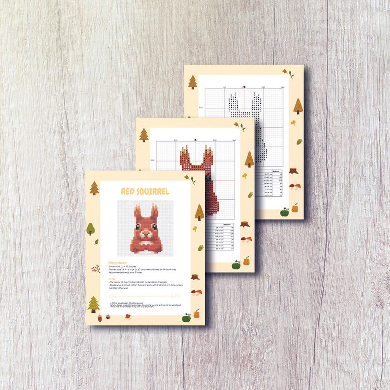 K&ouml;nnte beinhalten: Kreuzstichmuster f&uuml;r ein rotes Eichh&ouml;rnchen mit Anleitung und Farbtabelle. Das Muster ist 27 x 27 Stiche und verwendet 11 Farben.