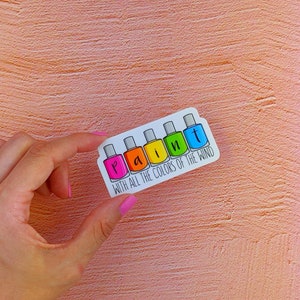 May include: A sticker with a row of colorful nail polish bottles spelling out the word "paint" with the text "with all the colors of the wind" below.