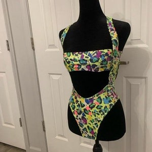 Roxy exotic bodysuit UV Reactive. Neon green.