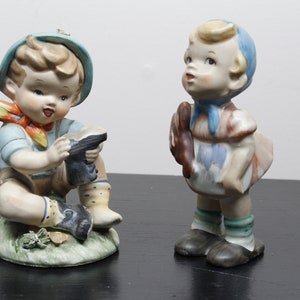 Vintage ceramic sitting boy and girl figurines by Lipper & Mann -Japan