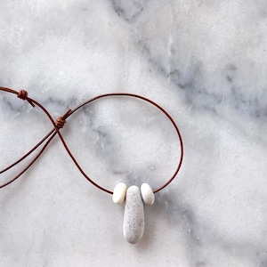 Three beach pebble pendant, beach stones necklace, pebble necklace in a adjustable light brown leather cord