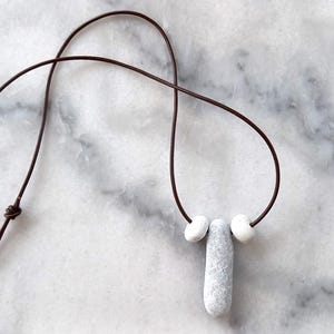 Three beach pebble pendant, beach stones necklace, pebble necklace in a adjustable dark brown leather cord