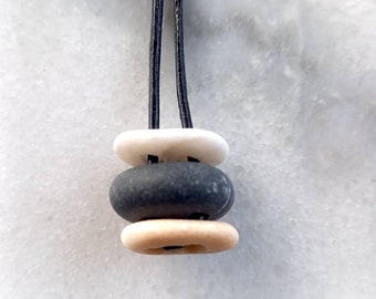 Three beach stone pendant, beach pebble necklace in an adjustable black leather cord